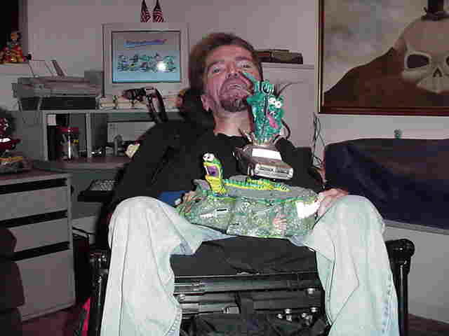 Bo holding some of his art work